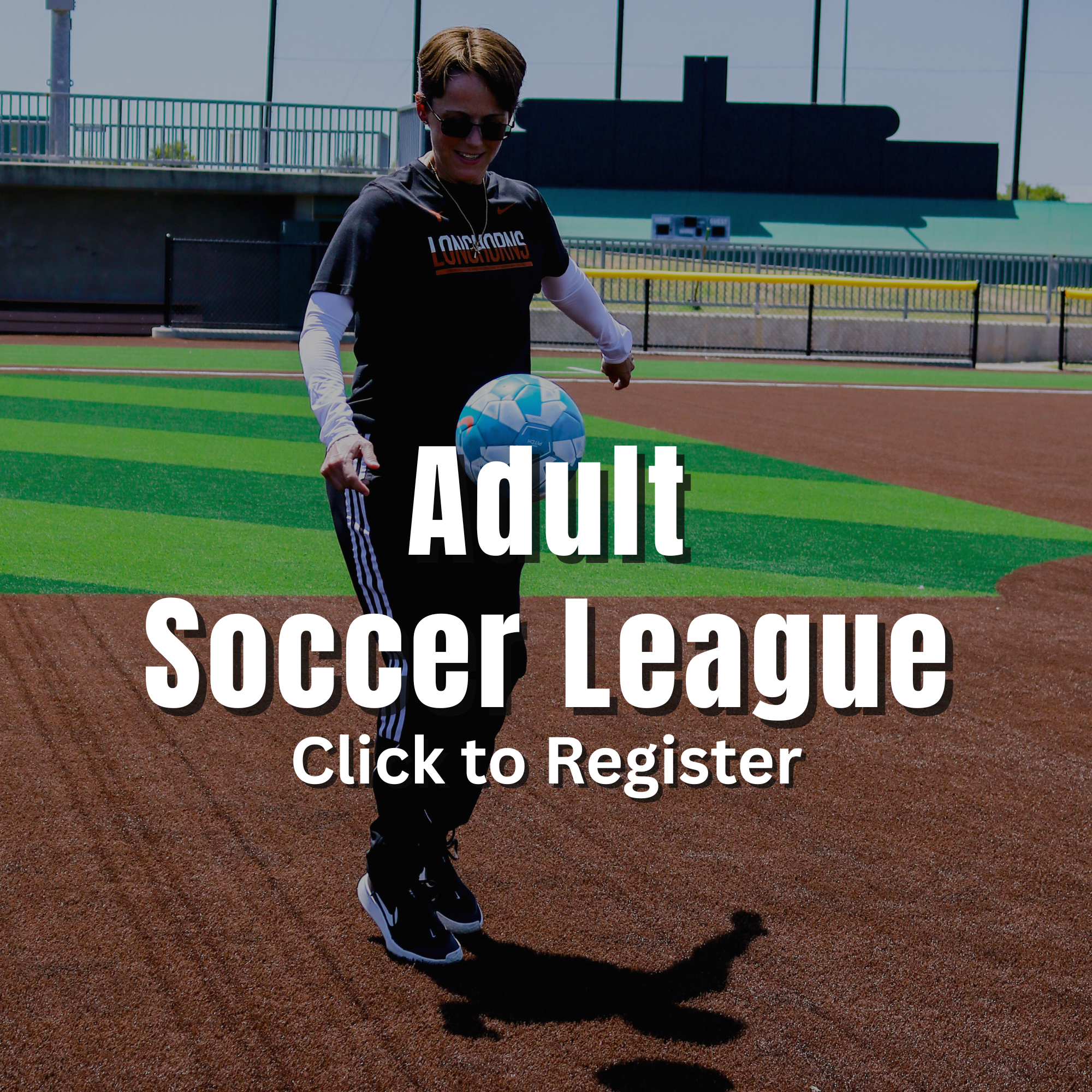 Adult Soccer A smiling young girl kicks a soccer ball toward a goal on a turf field at a youth soccer camp.